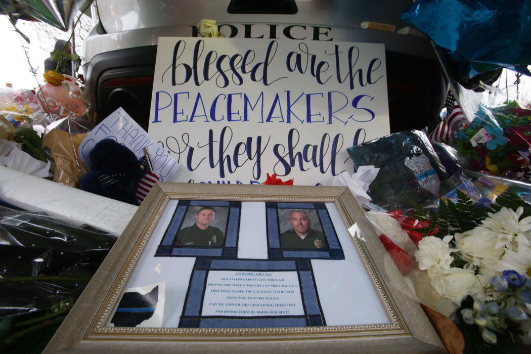 Second Place, Photographer of the Year - Small Market - Lorrie Cecil / ThisWeek NewspapersPictured here is part of an ever growing memorial in front of Westerville City Hall to honor fallen Westerville Police officers Eric Joering and Anthony Morelli.  