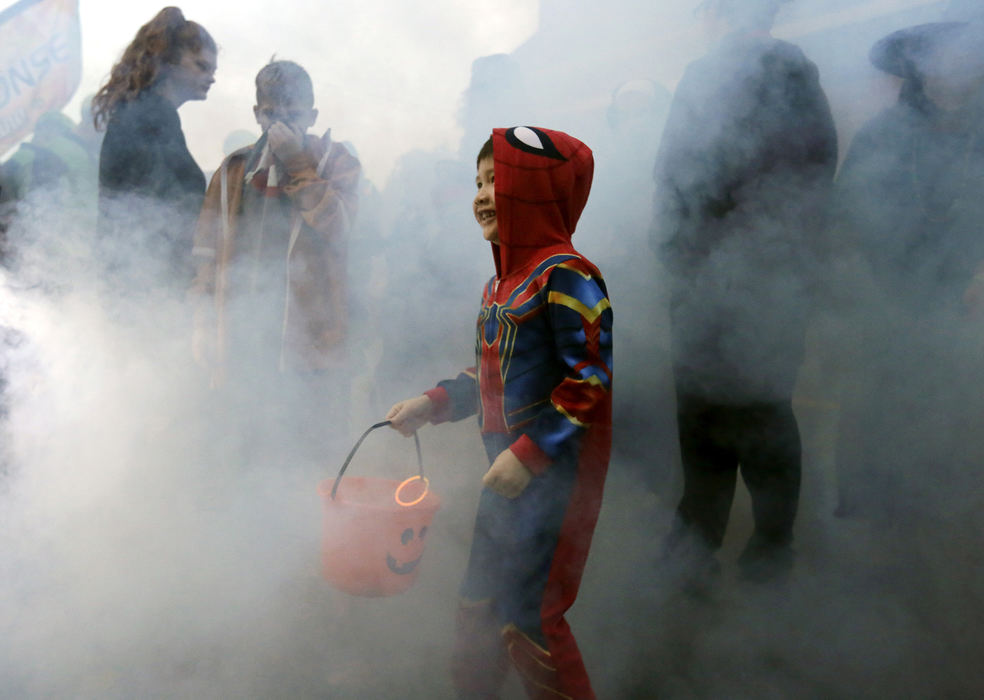 , Photographer of the Year - Small Market - Shane Flanigan / ThisWeek NewspapersJoeJoe Willis, 5, of Grove City, runs through the thick smoke billowing from a fog machine at the annual Boo Off Broadway trick-or-treat event, hosted by Grove City Parks and Recreation, Oct. 31, 2018, in Grove City, Ohio.