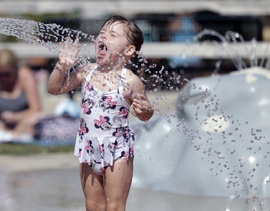 , Photographer of the Year - Small Market - Shane Flanigan / ThisWeek NewspapersEvelyn Lucas, 2, of Delaware, plays with a dinosaur-themed, water fountain at the Veterans Park splash pad July 17, 2018, in Delaware, Ohio.