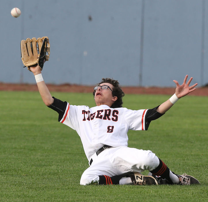 Award of Excellence, Photographer of the Year - Small Market - Scott Heckel / The Canton RepositoryMassillon's Jaylen Leedy slides to make the catch on a ball hit by Fitch's Kole Klasic during the third inning of their D1 district semifinal game at Thurman Munson Memorial Stadium in Canton on Monday, May 14, 2018. 