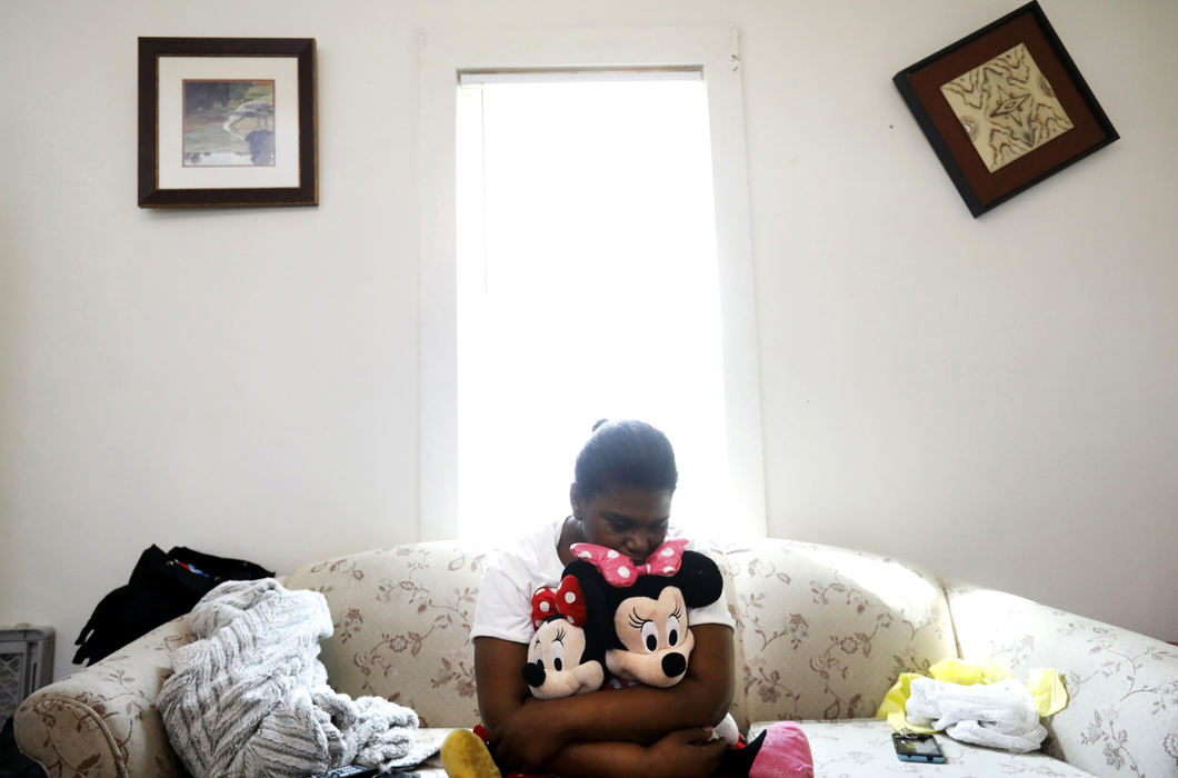 Second Place, Portrait Personality - Katie Rausch / The Blade, "Grandmother's Love""She was our oxygen," Kendra Hunter, 40, said as she clutched Minnie Mouse dolls belonging to her granddaughter Serenity Hunter, 1, who died April 4, 2018, after allegedly being hit and thrown into the couch, pictured, at her home in Toledo. The boyfriend of Serenity's mother Joshua Herron, 30, is charged with the murder. 