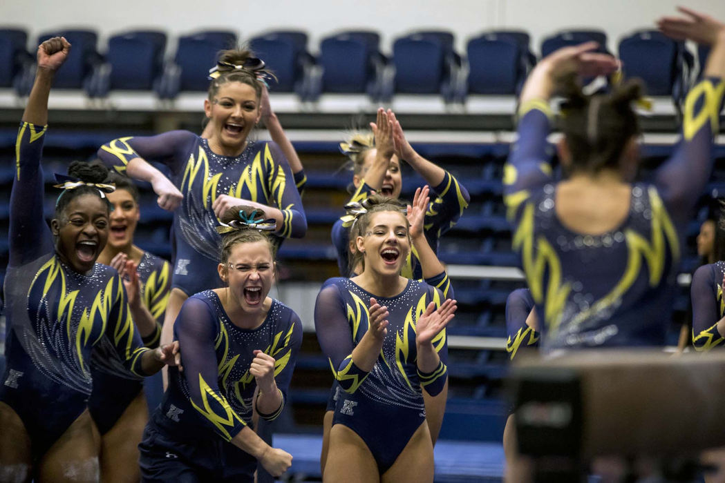 Third Place, Sports Feature - Nate Manley / Kent State University, "Stuck the Landing"Members of the Kent State Gymnastics team celebrate after junior Alyssa Quinlan lands her dismount on the beam during a tri-meet against George Washington and Temple at the M.A.C. Center, March 16, 2018.
