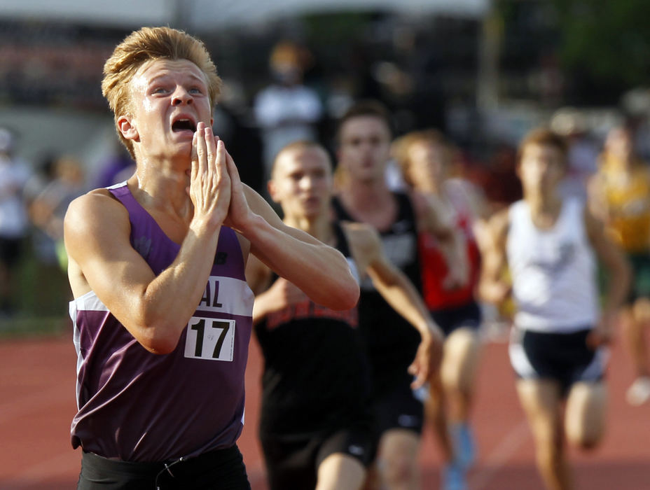 Award of Excellence, Sports Feature - Lorrie Cecil / ThisWeek Newspapers, "Champ"Pickerington Central's Matt Scrape looks up to the sky as he crosses the finish line to become Division I state champion in the 3200 meter on June 2, 2018 at Jesse Owens Memorial Stadium. The Tigers were the boys team champions.   
