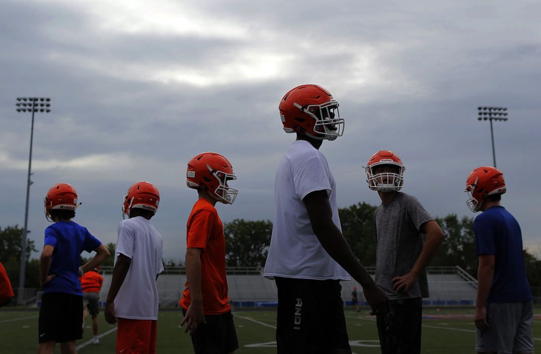 Second Place, Sports Picture Story - Kyle Robertson / The Columbus Dispatch, "Zach Harrison"Olentangy Orange's Zach Harrison lines up to start warming up before the start of practice on July 30, 2018. 