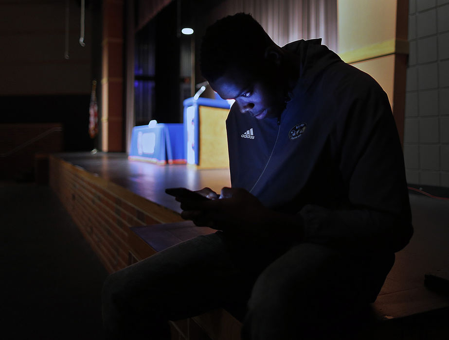 Second Place, Sports Picture Story - Kyle Robertson / The Columbus Dispatch, "Zach Harrison"Olentangy Orange's Zach Harrison drafts up his tweet of which school he will pick before his announcement that he will sign with Ohio State over Michigan and Penn State in front of family, friends and students at Olentangy Orange High School on December 19, 2018. 