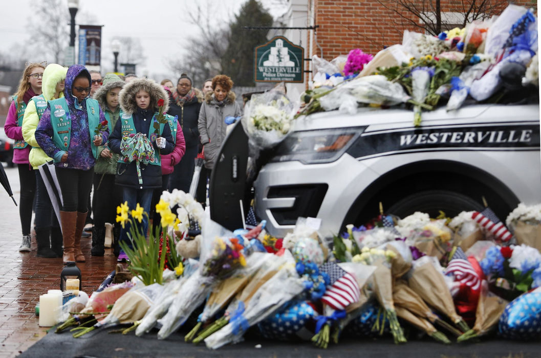 , Team Picture Story - Eric Albrecht / Dsipatch Media Group, "Westerville Strong"Westerville Girl Scouts from Troops 1270 and 1611 pay their respects at the memorial for Westerville police officers Anthony Morell and Eric Joering at Westerville City Hall February 11, 2018.