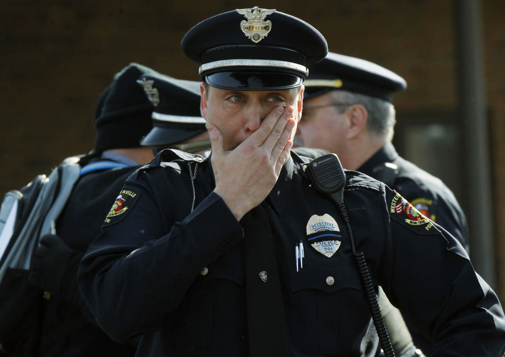 , Team Picture Story - Lorrie Cecil / Dsipatch Media Group, "Westerville Strong"Westerville Detective Steve Grubbs wipes away tears as he prepares to leave Moreland Funeral Home where the body of Officer Anthony Morelli was escorted.  The escort which included officers from around the state, then escorted the body Officer Eric Joering to Hill Funeral Home. 