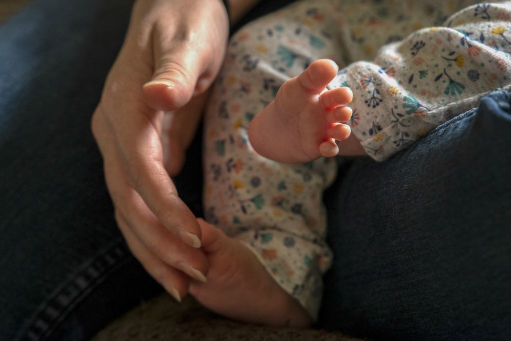 First Place, Chuck Scott Student Photographer of the Year - Gaelen Morse / Ohio UniversityKimi Francis, of Tuppers Plains, Ohio, tickles the feet of her six-week-old daughter, Charlotte, on a quiet Saturday afternoon at home on April 6, 2019.