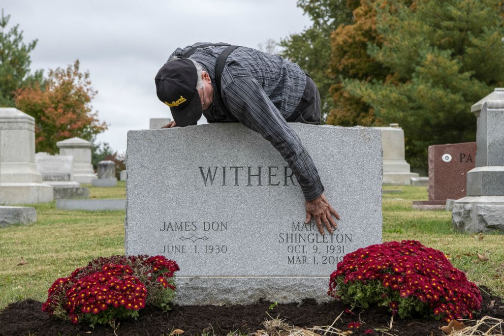 First Place, Chuck Scott Student Photographer of the Year - Gaelen Morse / Ohio UniversityDon Withers touches the engraved name of his late wife, Mary, on their gravestone after cleaning the monument and planting flower bulbs beside her that will bloom come spring. Oct. 29, 2019. Cynthiana, Ky.