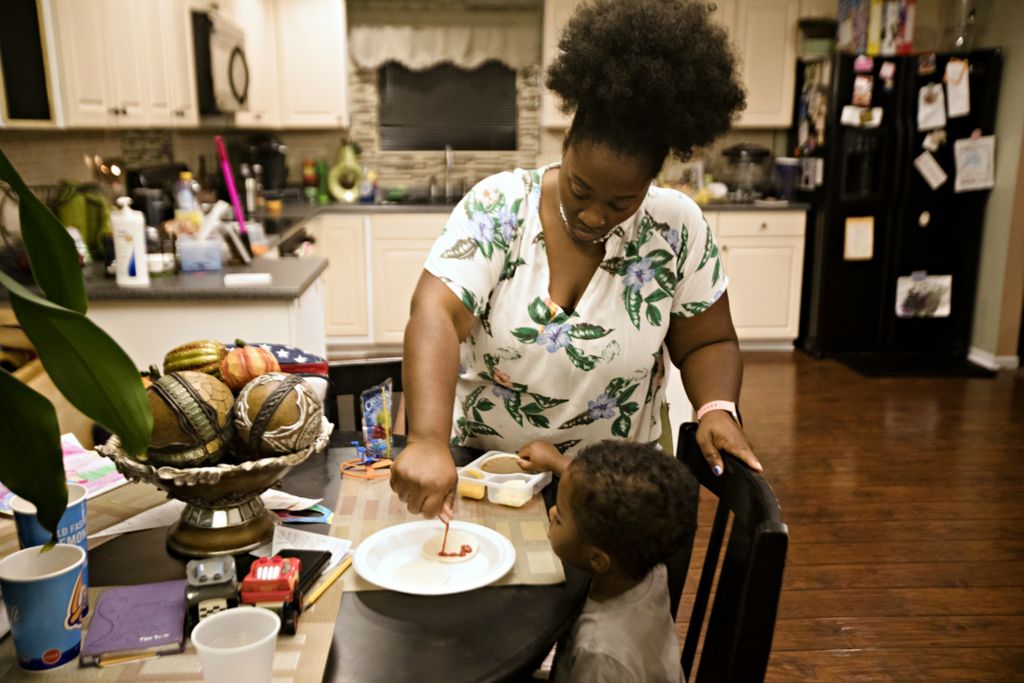 Third Place, Feature Picture Story - Albert Cesare / The Cincinnati Enquirer, “Finding Home”April Austin prepares a frozen pizza for Solomon Austin, 4, at the home of a family friend in Forest Park on Oct. 10, 2018. She and her four children stayed there for a month through the end October while waiting for a house to be ready in Madisonville. 