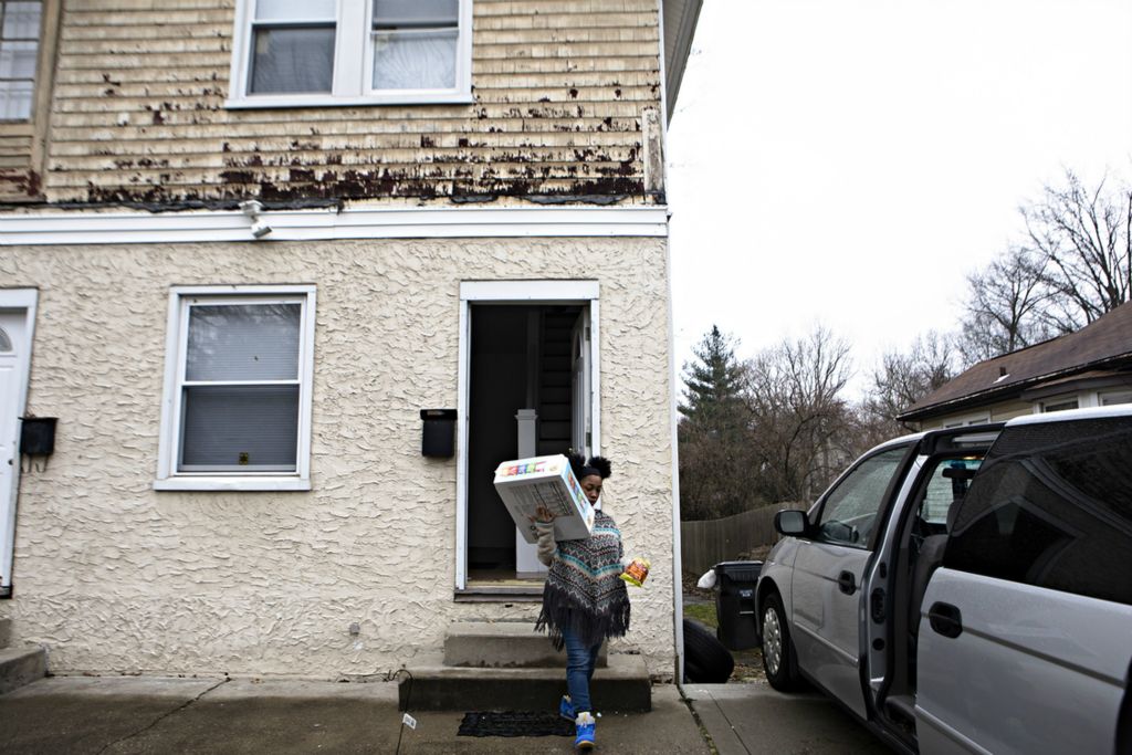 Third Place, Feature Picture Story - Albert Cesare / The Cincinnati Enquirer, “Finding Home”Genea Bouldin, 17, carries a box of chips from inside the rented house in Madisonville to the family van March 21, 2019, before a drive to Cleveland for her surgery.