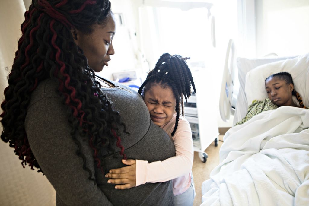 Third Place, Feature Picture Story - Albert Cesare / The Cincinnati Enquirer, “Finding Home”Jasmine Austin embraces her mother, April Austin, on March 23, 2019. Jasmine broke into tears when she was told that her big sister had to stay another night in the hospital following a 12-hour breast reduction operation at the Cleveland Clinic. 