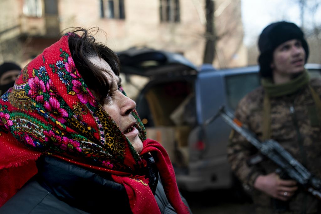 Award of Excellence, Feature Picture Story - Matthew Hatcher / Freelance, “Ukraine's Forgotten War”A woman takes one last look at her apartment as she prepares to board a truck to move away from the frontlines of Zolote-4, Ukraine on March 1, 2019. She and others, including children, occupied an apartment building just 30 yards from 'Point Zero' which they shared with Ukrainian Soldiers. After a night of heavy shelling that left the apartment building heavily damaged, most of the remaining civilians decided to flee. Soldiers helped the civilians pack up their few belongings and transported them to safer parts of Zolote.