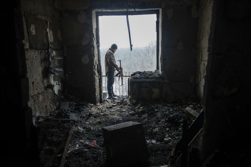 Award of Excellence, Feature Picture Story - Matthew Hatcher / Freelance, “Ukraine's Forgotten War”A Ukrainian soldier inspects the damage from a rocket attack on the apartment building that soldiers and civilians shared the morning after heavy fighting in Zolote-4, Ukraine on February 25, 2019. Shelling and sporadic fighting between Russian backed separatists continues daily in places along the frontlines.