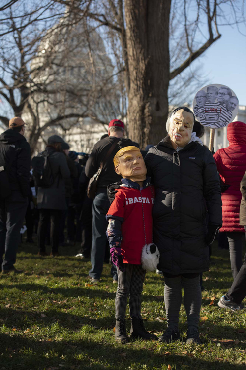 Second Place, Larry Fullerton Photojournalism Scholarship - Alexandria Skowronski / Ohio UniversityEmery Morales (left) and her mother Ryann (right) attend the "Impeach Trump" rally outside the Capitol Building and across the street from the US Senate on the morning of December 18, 2019; the day Congress voted in favor to impeach President Trump. "We're here today because we want to encourage the Congress and the Senate to impeach the president, and I want to show the kids to stand up and do the right thing even if it's the hard  thing." 