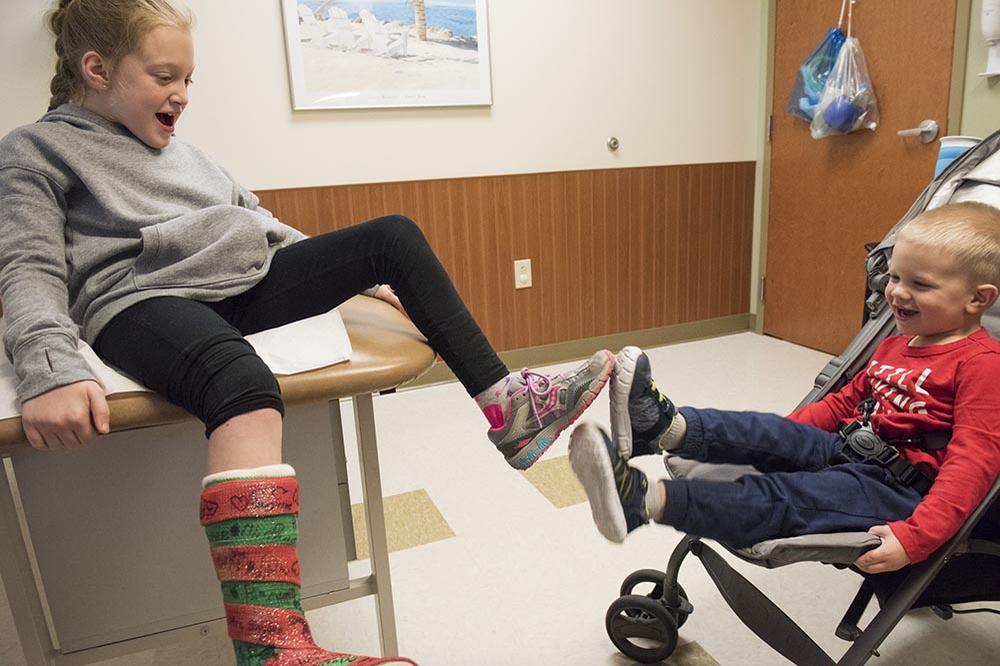 Second Place, Larry Fullerton Photojournalism Scholarship - Alexandria Skowronski / Ohio UniversitySophia plays around with her brother Charlie on December 28, 2018, at the Cleveland Clinic just before her cast removal from her last surgery in November. 