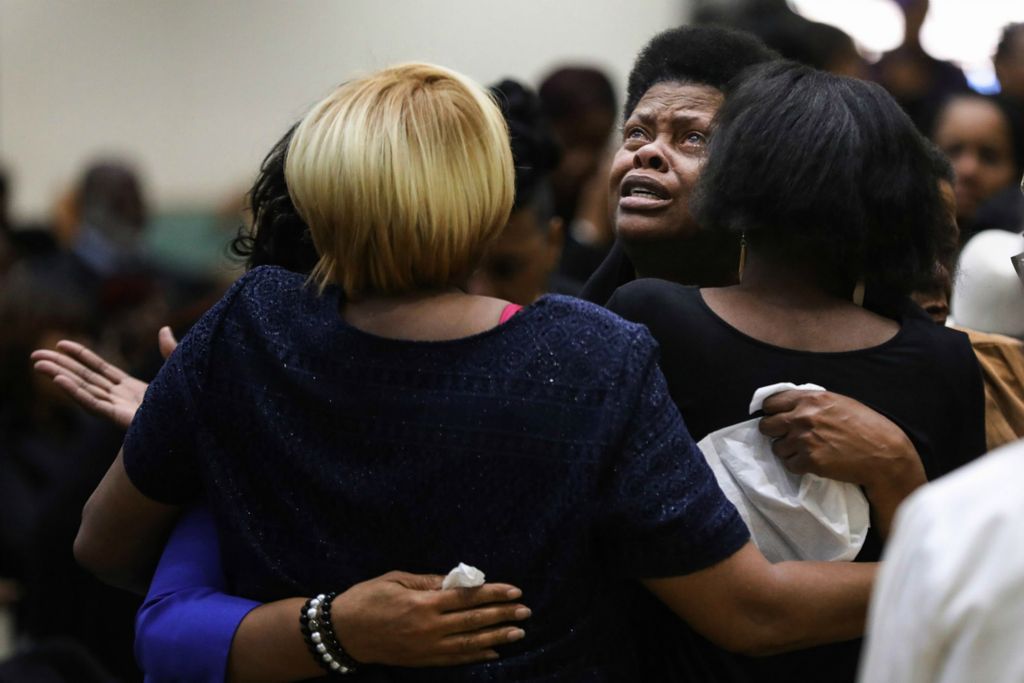 Second Place, General News - Rebecca Benson / The Blade, “Clifford Murphy Funeral ”iJacqueline Murphy looks up and cries as she is consoled by family members during the funeral for jazz musician Clifford Murphy at Mount Pilgrim Church in Toledo on December 7, 2019.