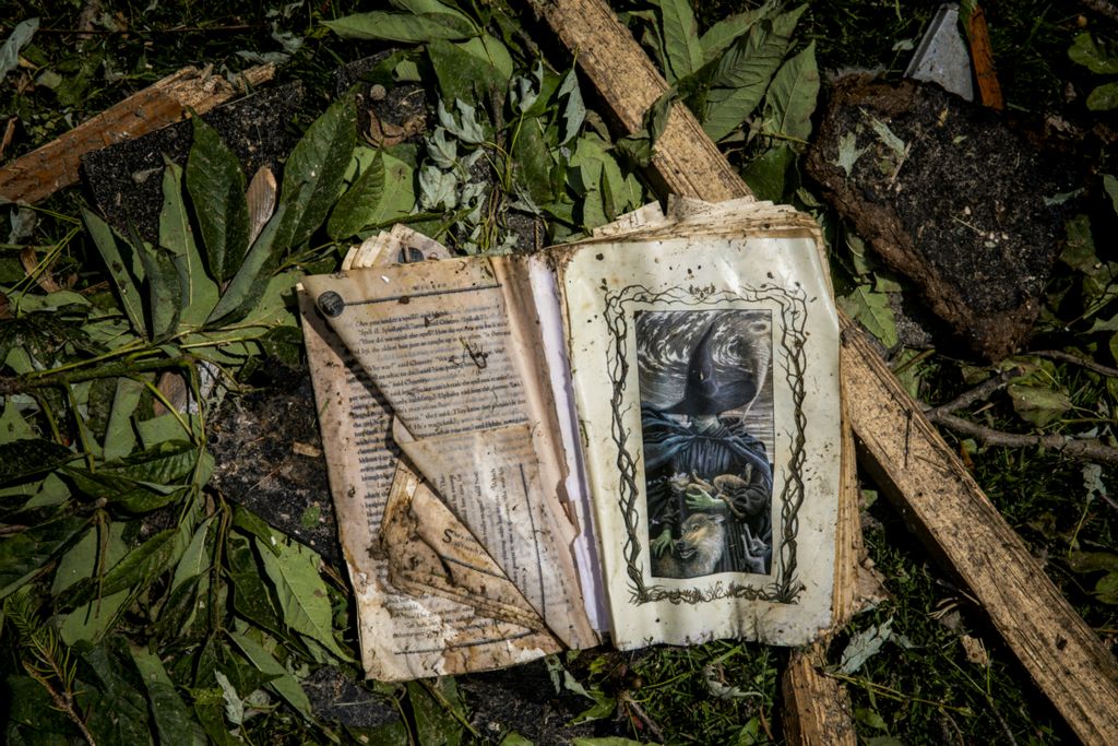 Third Place, News Picture Story - Meg Vogel / The Cincinnati Enquirer, “Brookville Tornado”A copy of "Wicked" was found outside a home that was destroyed by tornadoes in Brookville, Ohio on Tuesday, May 28, 2019.