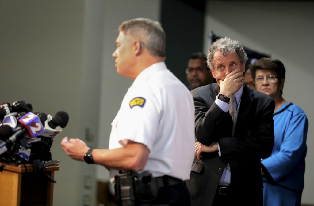 First Place, News Picture Story - Kurt Steiss / The Blade, “Dayton Shooting”U.S. Senator Sherrod Brown, back right, listens as Dayton Police Chief Richard Biehl gives a briefing to the media about the mass shooting during a press conference at Dayton Convention Center in Dayton, Ohio, on Sunday, Aug. 4, 2019.