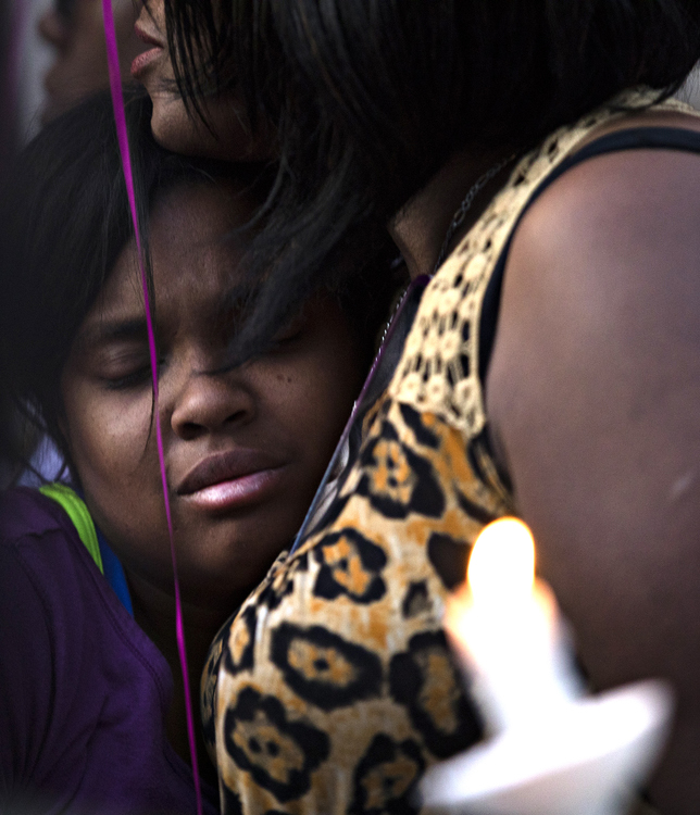 Award of Excellence, News Picture Story - Albert Cesare / The Cincinnati Enquirer, “Mass Shooting Dayton ”A woman embraces a child outside Ned Pepper's Bar during a vigil for the victims of  a mass shooting in the Oregon District of Dayton, Ohio, on Sunday, Aug. 4, 2019. 