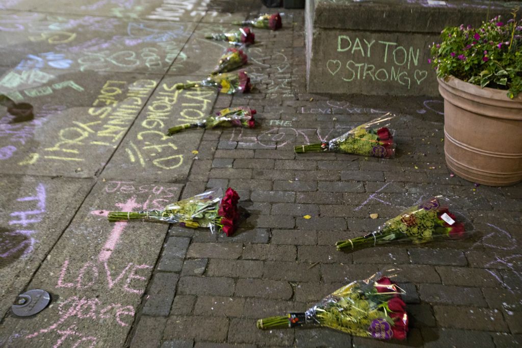 Award of Excellence, News Picture Story - Albert Cesare / The Cincinnati Enquirer, “Mass Shooting Dayton ”9 bouquets of roses are laid on the sidewalk on the 400 block of East 5th Street where there was a mass shooting that killed ten, including the shooter, in the Oregon District of Dayton, Ohio, on Sunday, Aug. 4, 2019. 