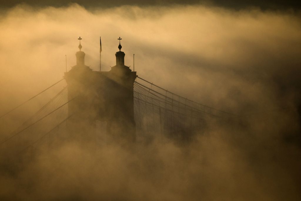 Third Place, Pictorial - Albert Cesare / The Cincinnati Enquirer, “Fog”A view of the John A. Roebling Suspension Bridge surrounded by fog from the Ohio River on Dec. 24, 2019, in Cincinnati. 
