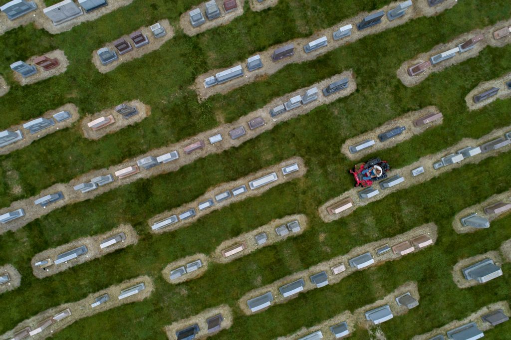 First Place, Pictorial - Andy Morrison / The Blade, “Shalom Cemetery”Superintendent Jack Fry mows the grass at the Beth Shalom Cemetery in Oregon, Sept. 5, 2019. 