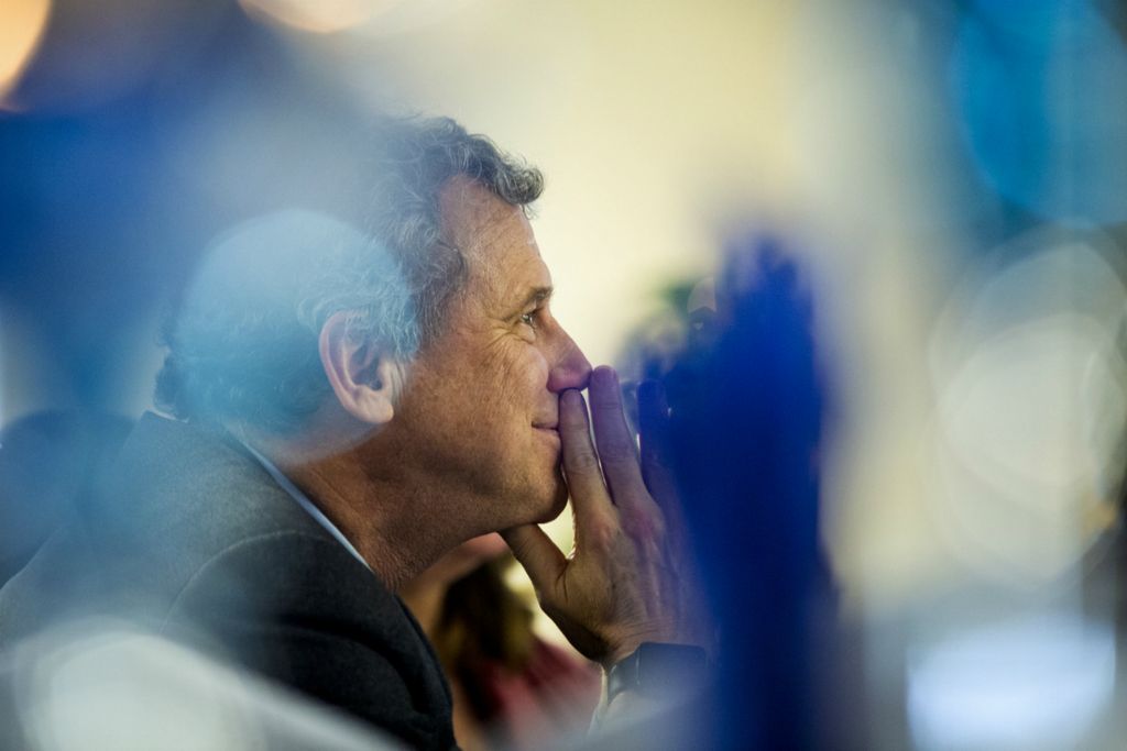 First Place, Photographer of the Year - Large Market - Meg Vogel / The Cincinnati EnquirerSen. Sherrod Brown listens to Sen. Gerald Malloy introduce him and his wife, Connie Schultz, at the Democratic Women of Darlington County's Annual Women's History Month Trailblazer Award Luncheon at the Jerusalem Baptist Church Fellowship Hall in Hartsville, S.C. on Saturday, March 2, 2019. This visit was part of his Dignity of Work tour. Sen. Brown traveled around Iowa, New Hampshire and South Carolina exploring the idea of running for president. 