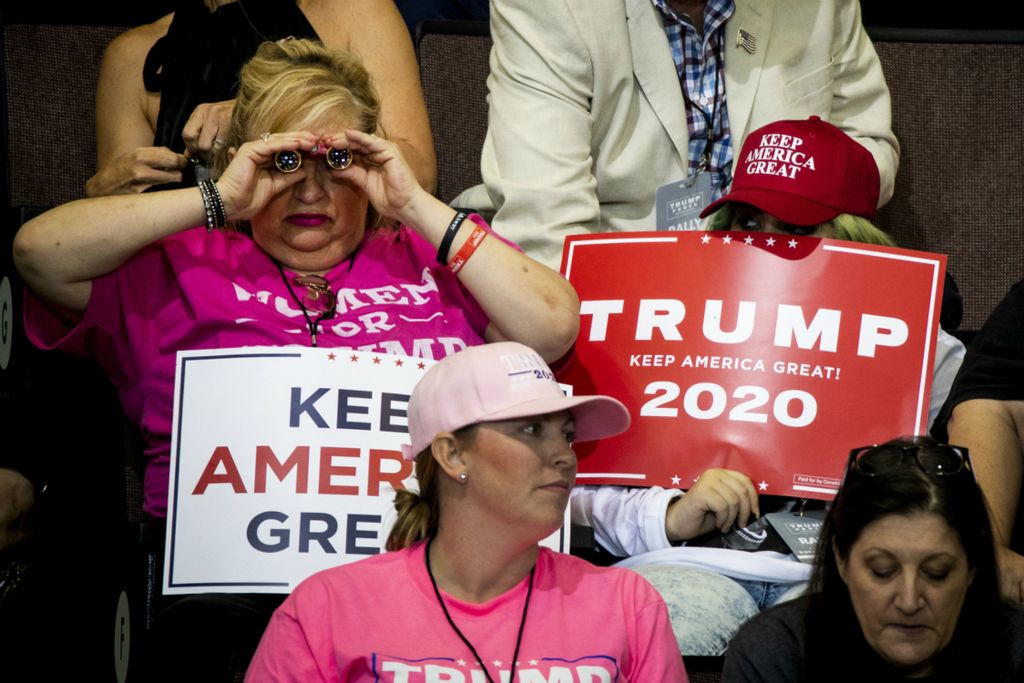 First Place, Photographer of the Year - Large Market - Meg Vogel / The Cincinnati EnquirerSupporters wait for President Donald Trump to address the crowd at his "Keep America Great" campaign rally on Thursday, August 1, 2019 at U.S. Bank Arena in downtown Cincinnati.