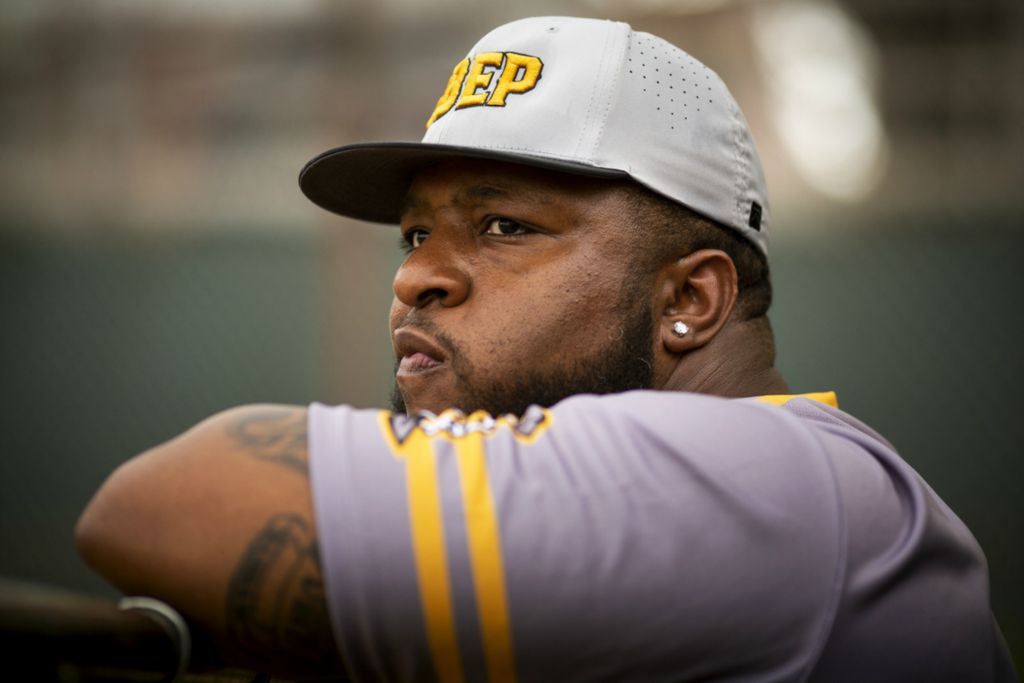 First Place, Photographer of the Year - Large Market - Meg Vogel / The Cincinnati EnquirerSt. Bernard Titans coach Fred James watches his team warmup before playing Lockland at Ross Park in St. Bernard on Tuesday, April 23, 2019. This was his first season as head coach of the Titans baseball team. James, the son of a preacher, prays a lot about his job. He’s a baseball guy, a former minor leaguer, so he knew what he was getting into when he took over a team that had been outscored 571-76 the previous two seasons.