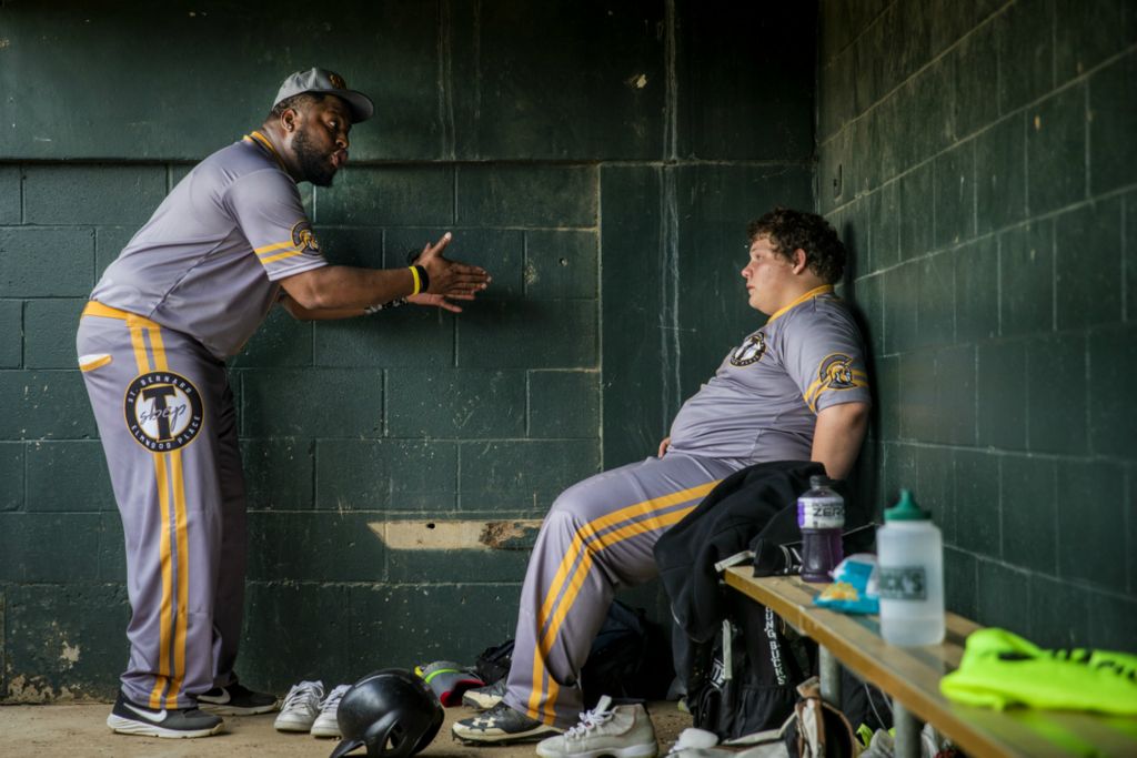 First Place, Photographer of the Year - Large Market - Meg Vogel / The Cincinnati EnquirerSt. Bernard Titans coach Fred James instructs Dwayne "Pot Pot" Pottinger on how to keep his composure, after Pot Pot was taken out of the game for reacting to a teammate’s error in the third inning against Lockland at Ross Park in St. Bernard on Tuesday, April 23, 2019.