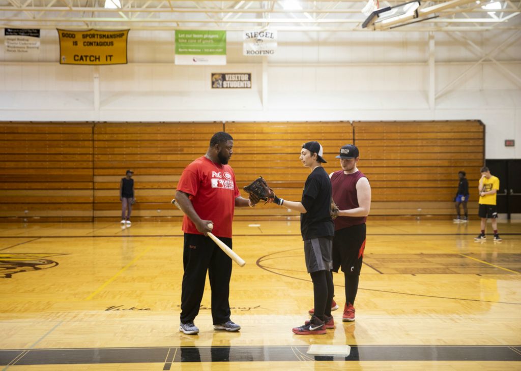 First Place, Photographer of the Year - Large Market - Meg Vogel / The Cincinnati EnquirerSt. Bernard Titans coach Fred James leads a practice in the St. Bernard-Elmwood Place gym on Friday, April 19, 2019. For many of his players, this is their first time playing baseball. He has to start from square one. 