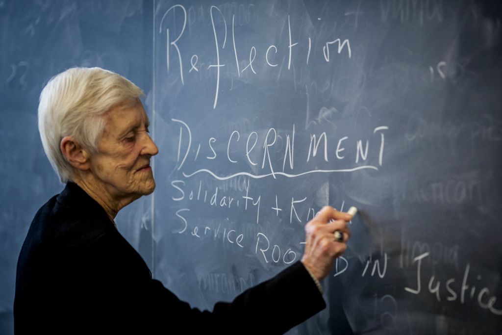 First Place, Photographer of the Year - Large Market - Meg Vogel / The Cincinnati EnquirerSr. Rose Ann Fleming writes the values of Xavier University on the chalkboard for her CORE 102 class on Monday, January 28, 2019 in Alter Hall at Xavier University.