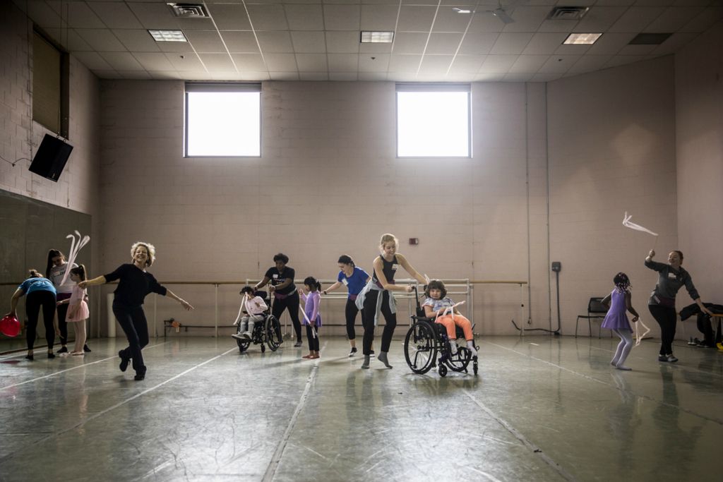 First Place, Photographer of the Year - Large Market - Meg Vogel / The Cincinnati EnquirerThe Ballet Moves class and volunteers dance around the studio with ribbon wands at the Cincinnati Ballet on Saturday, February 2, 2019. The Cincinnati Ballet partnered with Cincinnati Children's Hospital to design the Ballet Moves program six years ago. It was created for students with specific needs between the ages of ages 4 and 14. Each dancer is paired with a Cincinnati Children’s Hospital physical therapist.  