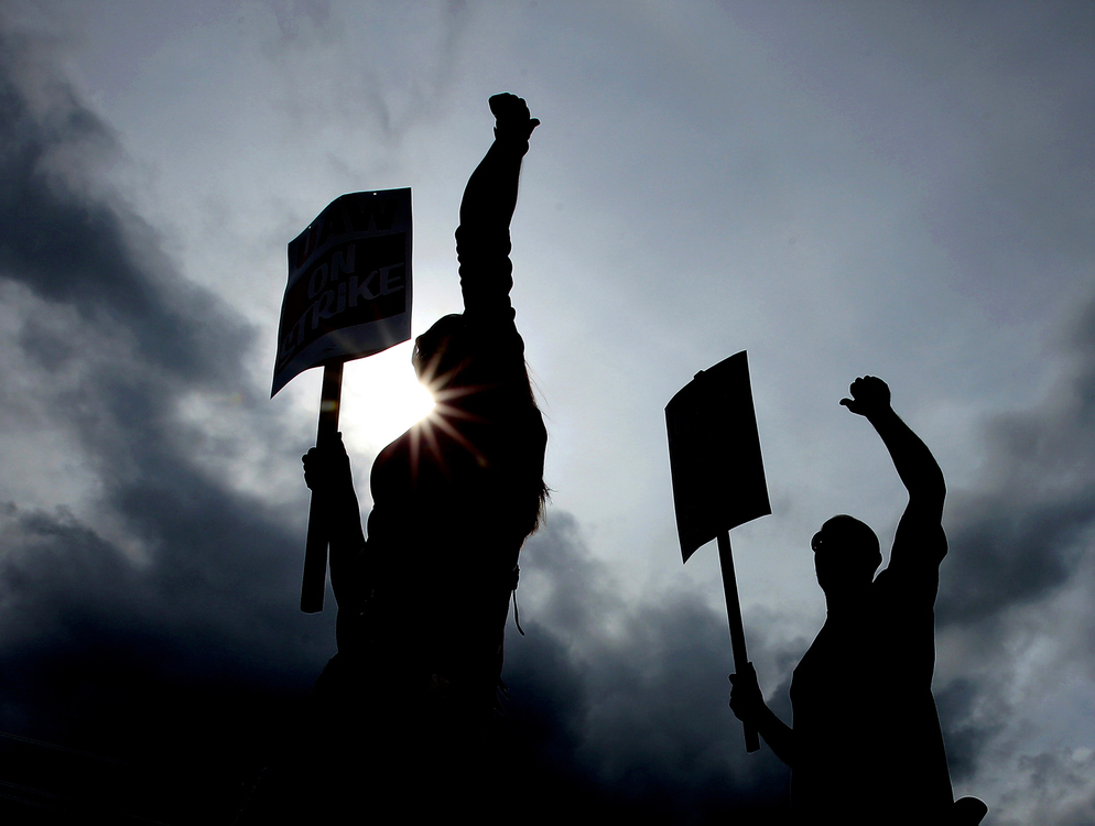 Second Place, Photographer of the Year - Large Market - Lisa DeJong / The Plain DealerUnited Automobile Workers continue to strike along Chevrolet Boulevard outside of the General Motors Parma Metal Center. About 49,000 General Motors employees across the country went on strike at 11:59 p.m. on Sunday night after negotiations fractured. Al Tiller, shop chairman of UAW Local 1005, says they are fighting for survival of the middle class. "This is not just an attack on the UAW, they are attacking our communities and they are attacking the entire middle class," Tiller said. Here UAW workers will walk the picket line at five different areas around the huge Parma plant at Chevrolet Boulevard and Brookpark Road. 