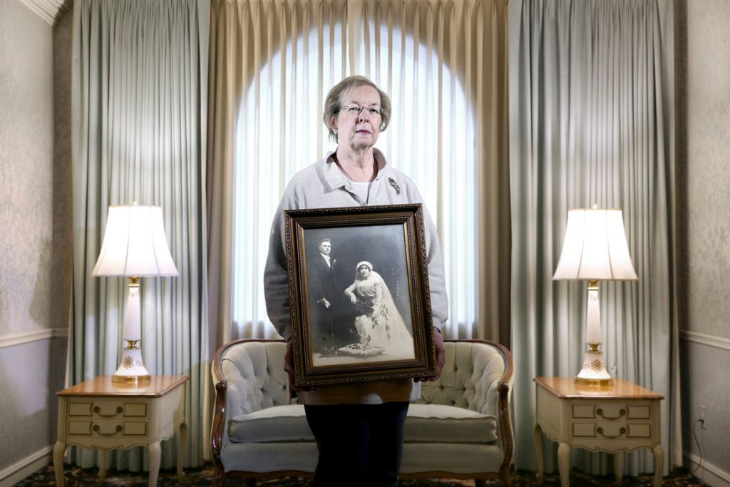 Second Place, Photographer of the Year - Large Market - Lisa DeJong / The Plain DealerThough Linda Golubski has buried most of her neighbors, she intends to continue to breathe life into her troubled Slavic Village neighborhood. Linda Golubski, 67, holds the 1913 wedding portrait of her grandparents, Joseph and Martha Golubski, who also started the Golubski Funeral home in 1913. Linda Golubski and her six siblings grew up living above the funeral home and still lives above the embalming quarters while running the family business. Though the old grocer and butcher shop are boarded up on her street, Golubski thinks the neighborhood can recover from the foreclosure crisis. She is not leaving. "It was a wonderful experience growing up here.”