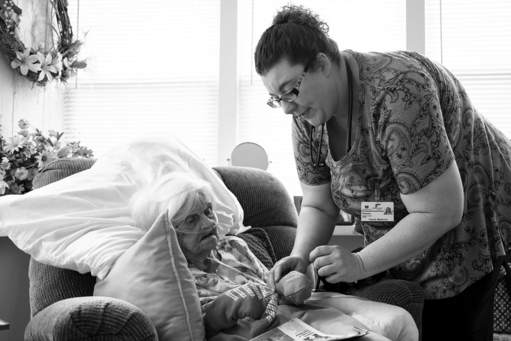 Third Place, Photographer of the Year - Large Market - Joshua A. Bickel / The Columbus DispatchNurse Beka Copley asks her patient, Kathryn Davidson, 96, if she can take off her gloves to check her hands during a home visit on Tuesday, August 20, 2019 in South Point, Ohio. “The best for me is connecting with my patients,” Beka said. “I talk to them, I listen, I hold their hand and feel what they’re feeling.”