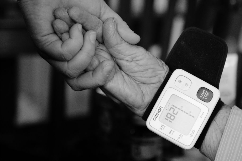 Third Place, Photographer of the Year - Large Market - Joshua A. Bickel / The Columbus DispatchNurse Beka Copley holds the hand of Betty Gibson while checking her blood pressure during a home visit on Wednesday, October 23, 2019 in South Point, Ohio.