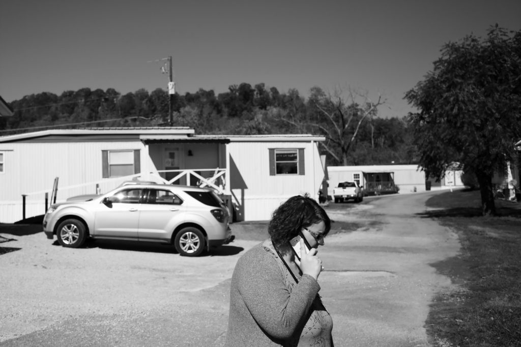 Third Place, Photographer of the Year - Large Market - Joshua A. Bickel / The Columbus DispatchAfter seeing a patient, nurse Beka Copley takes a call from another nurse out in the field on Wednesday, October 23, 2019 in Chesapeake, Ohio. The nurse called Beka after her patient had become threatening seeking advice. "Get out of there," Beka replied, adding that their office would follow up with the patient's family and decide whether to keep them as a patient.