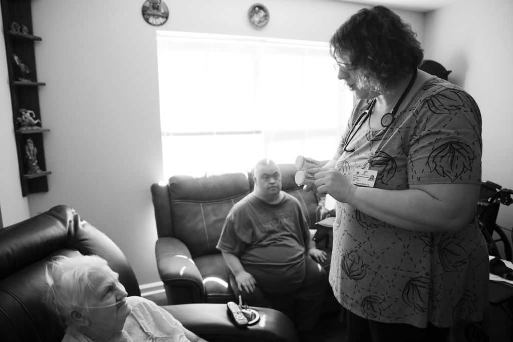 Third Place, Photographer of the Year - Large Market - Joshua A. Bickel / The Columbus DispatchNurse Beka Copley chats with Elsie Dempsey, 76, of Proctorville, about her medications while making a house call on Wednesday, October 23, 2019 in Proctorville, Ohio. Often, Copley spends her home visits doing basic check-ins, making sure they have simple things like medication and flu shots.