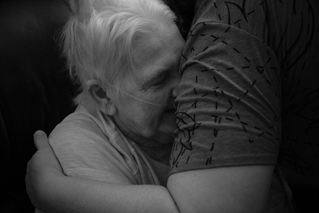 Third Place, Photographer of the Year - Large Market - Joshua A. Bickel / The Columbus DispatchElsie Dempsey, 76, of Proctorville, hugs nurse Beka Copley as she leaves her home following a visit on Wednesday, October 23, 2019 in Proctorville, Ohio.