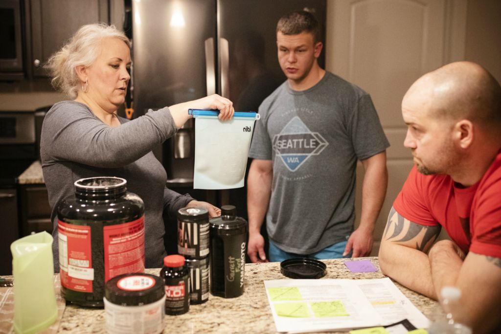 Third Place, Photographer of the Year - Large Market - Joshua A. Bickel / The Columbus DispatchAfter packing Garrett's protein powder in a reusable bag for him as she prepares for his upcoming trip to the Special Olympics World Games, Leah shows Garrett how to seal the bag closed on Tuesday, March 5, 2019 at his home in Pataskala, Ohio. Garrett struggles to remember things like small, repetitive tasks because of his autism, so Leah makes it a point to teach and remind him how to do things.