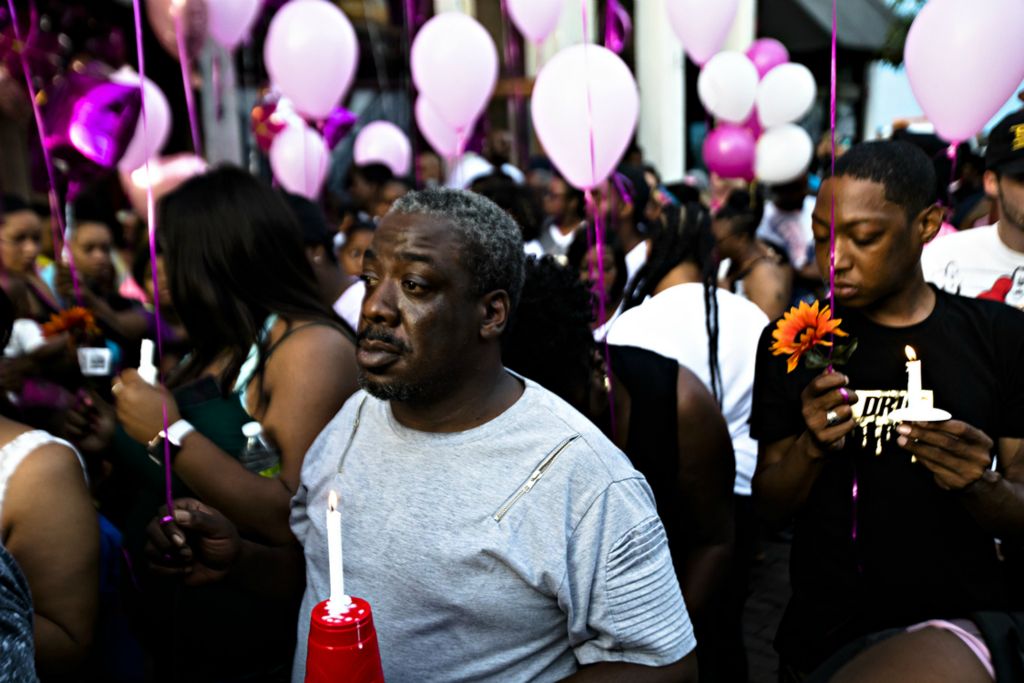 Award of Excellence, Photographer of the Year - Large Market - Albert Cesare / The Cincinnati EnquirerJoe Oglesby stands outside Ned Pepper's Bar where his niece, Lois Oglesby died, during a vigil for the victims of  a mass shooting in the Oregon District of Dayton, Ohio, on Sunday, Aug. 4, 2019. 