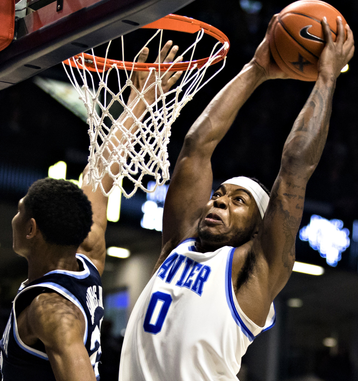 Award of Excellence, Photographer of the Year - Large Market - Albert Cesare / The Cincinnati EnquirerXavier Musketeers forward Tyrique Jones (0) dunks over Villanova Wildcats forward Jermaine Samuels (23) in the second half of the NCAA men's basketball game between Xavier Musketeers and Villanova Wildcats on Saturday, Feb. 24, 2019, at Cintas Center in Cincinnati. Xavier Musketeers defeated Villanova Wildcats 66-54.