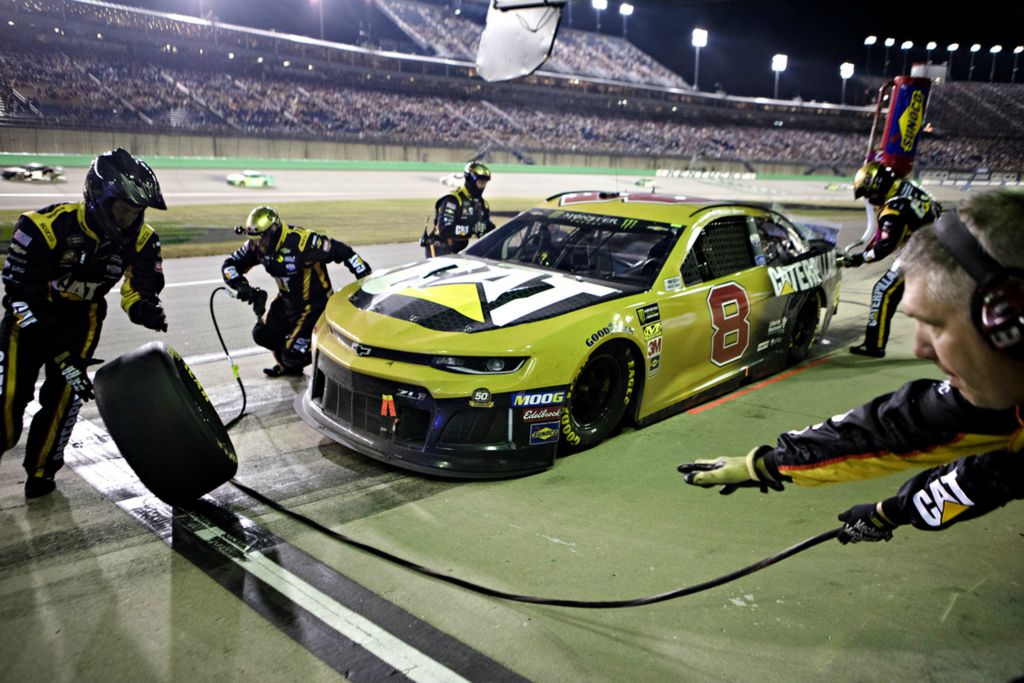 Award of Excellence, Photographer of the Year - Large Market - Albert Cesare / The Cincinnati EnquirerMonster Energy NASCAR Cup Series driver Daniel Hemric (8) pulls into the pit as his crew changes tires during the NASCAR Monster Energy Cup Series Quaker State 400 race, Saturday, July 13, 2019, at the Kentucky Speedway in Sparta, Ky. 