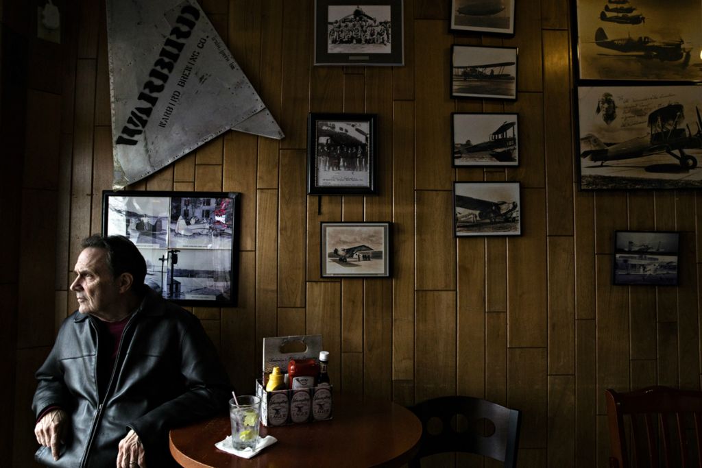Award of Excellence, Photographer of the Year - Large Market - Albert Cesare / The Cincinnati EnquirerDenny Peter stares out the window at the airstrip at of Lunken Airport while dining at Sky Galley in East End on Friday, Dec. 13, 2019. Peter said he has been eating at Sky Galley for 20 years and brings his grandchildren to watch the planes from the restaurant. The Sky Galley was set to close the following month due to a lease agreement falling through with the City of Cincinnati. 