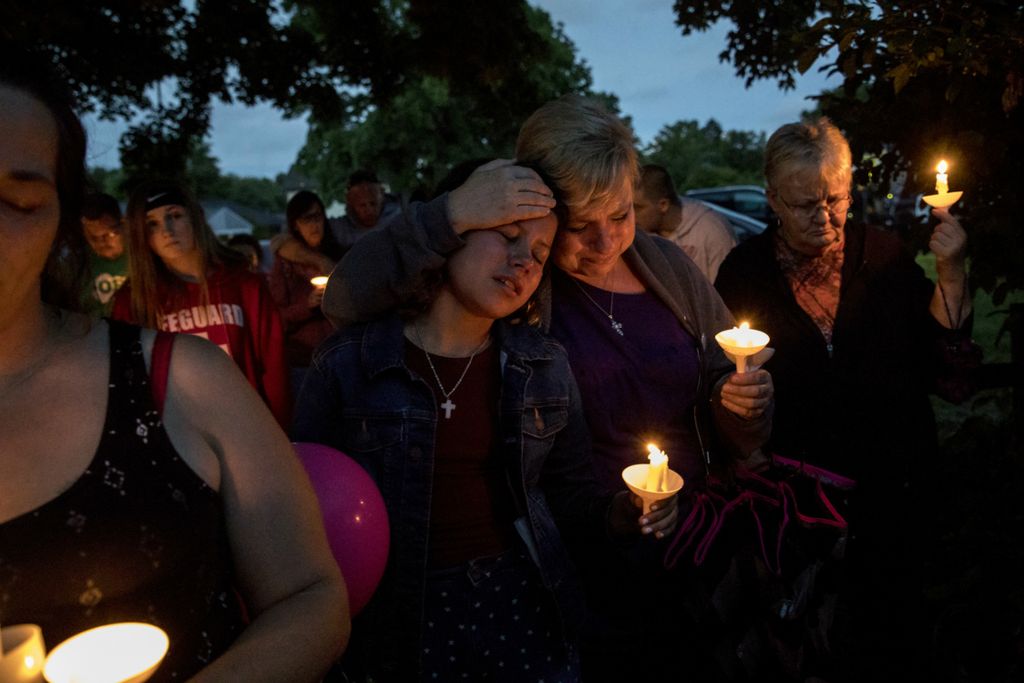 First place, Photographer of the Year - Small Market - Jessica Phelps / Newark AdvocateHundreds of friends, family members and members of the community gather at the home of Isabella Barnes to honor her life on June 24, 2019. Barnes was fatally shot in the head while sitting on her front porch. Keegan Mummey, 18, of Newark, was charged in her murder. The following month, a Licking County grand jury indicted Mummey on one count each aggravated murder, an unclassified felony; rape, a first-degree felony; and tampering with evidence, a third-degree felony. Mummey was later found incompetent to stand trial.