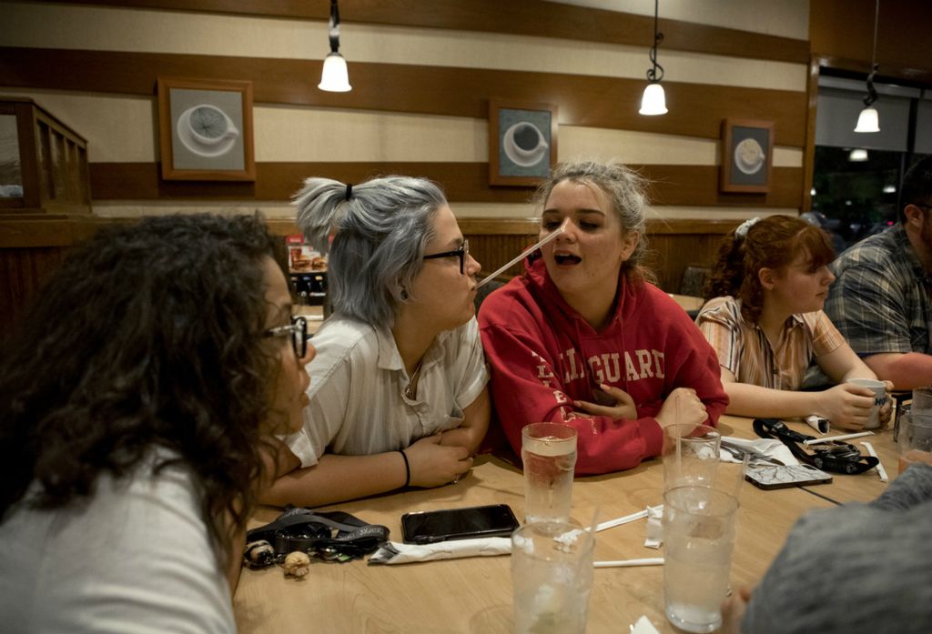 First place, Photographer of the Year - Small Market - Jessica Phelps / Newark AdvocateJazmin and fellow classmate Arin Wade, along with the rest of their drama class went to I-HOP after their final performance for the school year, May 24, 2019. Instead of shutting out the world after the death of both her parents almost two years ago, Jazmin has strengthened her friendships and dove into her art work and the theater as ways to cope. She has managed to thrive despite her hardships earning a full scholarship to Kent State University in the Fall. 