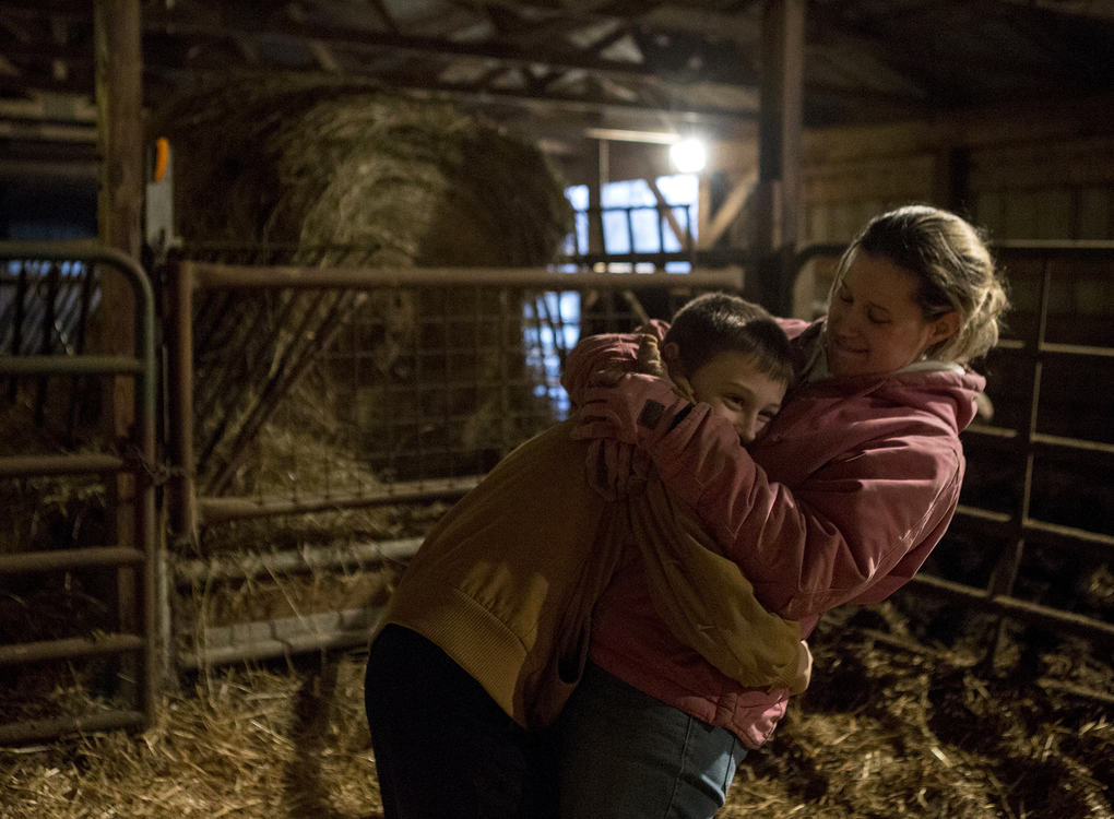 First place, Photographer of the Year - Small Market - Jessica Phelps / Newark AdvocateBryce runs to his mom playfully giving her a big hug in the cow barn, January 5, 2019. Bryce is always very affectionate with his parents, and says he loves living on a farm because he gets to spend time with the cows that he loves and go" exploring" on the land the family owns. 