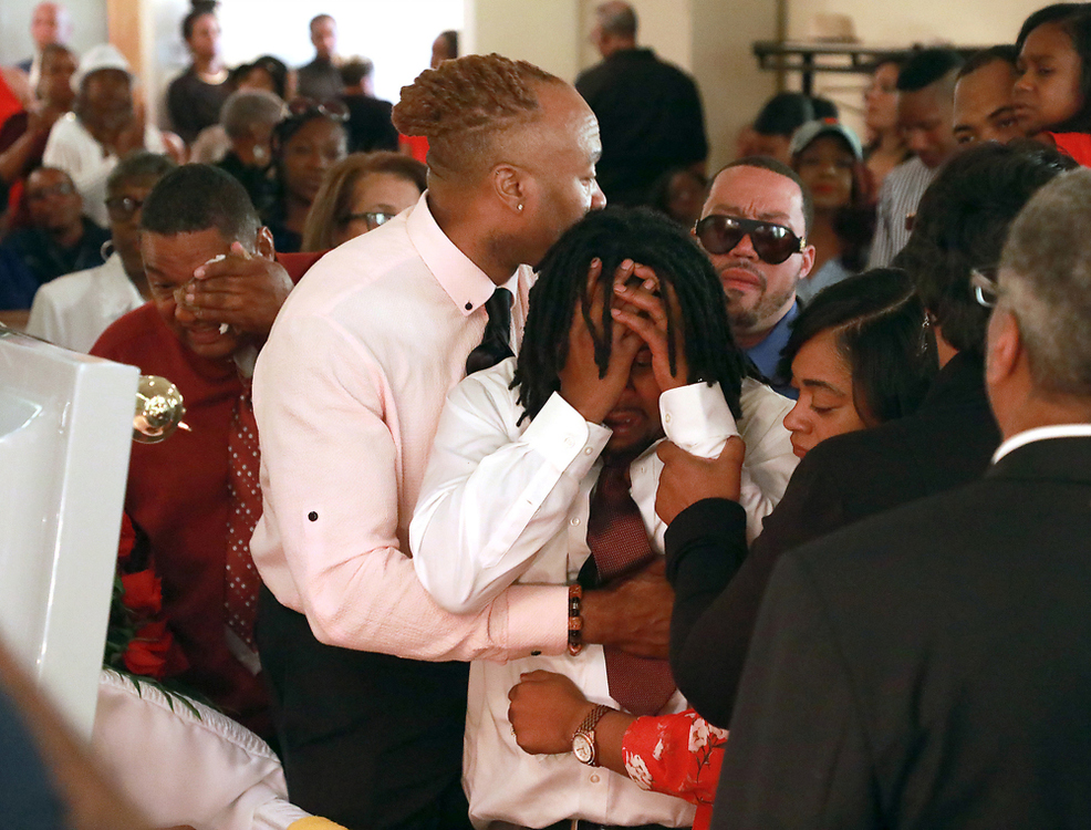 Second Place, Photographer of the Year - Small Market - Bill Lackey / Springfield News-SunDion Green, the son of Derrick Fudge, breaks down as he tries to say goodbye during the funeral services for his father Saturday at St. John Missionary Baptist Church. Fudge, a Springfield native, was killed during the mass shooting in the Oregon District in Dayton.